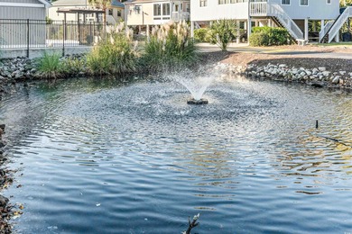 Located just a short golf cart ride from the beach, this on Possum Trot Golf Course in South Carolina - for sale on GolfHomes.com, golf home, golf lot