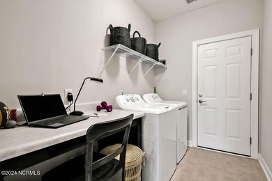 A beautiful and well-maintained home. The Owen, built by True on Cape Fear National At Brunswick Forest in North Carolina - for sale on GolfHomes.com, golf home, golf lot