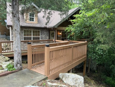 This pristine lodge located at the Cabins on Roark Creek in on Ledgestone Country Club and Golf Course in Missouri - for sale on GolfHomes.com, golf home, golf lot