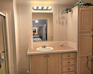 This 2 bedroom, 2 bath has approximately 1000 feet of living on Southport Springs Golf Club in Florida - for sale on GolfHomes.com, golf home, golf lot