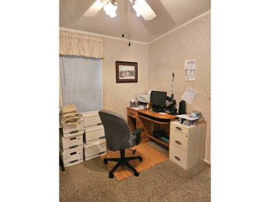 This 2 bedroom, 2 bath has approximately 1000 feet of living on Southport Springs Golf Club in Florida - for sale on GolfHomes.com, golf home, golf lot