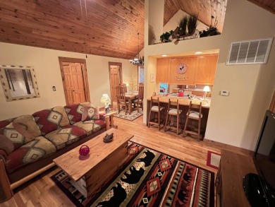 This pristine lodge located at the Cabins on Roark Creek in on Ledgestone Country Club and Golf Course in Missouri - for sale on GolfHomes.com, golf home, golf lot