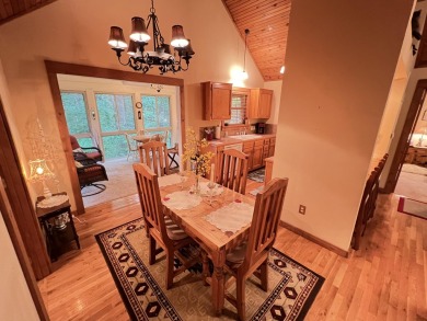 This pristine lodge located at the Cabins on Roark Creek in on Ledgestone Country Club and Golf Course in Missouri - for sale on GolfHomes.com, golf home, golf lot