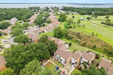 Discover your perfect coastal retreat in Perdido Bay Villas! on Perdido Bay Golf Club in Florida - for sale on GolfHomes.com, golf home, golf lot