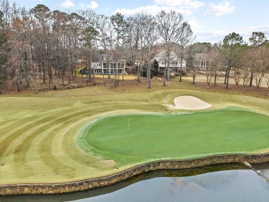 OVERLOOKING THE SIGNATURE 5TH HOLE OF THE JACK NICKLAUS DESIGNED on Great Waters Course At Reynolds Plantation in Georgia - for sale on GolfHomes.com, golf home, golf lot