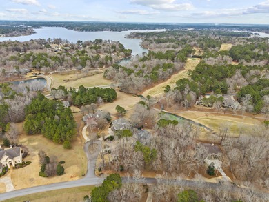 OVERLOOKING THE SIGNATURE 5TH HOLE OF THE JACK NICKLAUS DESIGNED on Great Waters Course At Reynolds Plantation in Georgia - for sale on GolfHomes.com, golf home, golf lot