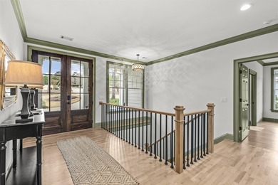 OVERLOOKING THE SIGNATURE 5TH HOLE OF THE JACK NICKLAUS DESIGNED on Great Waters Course At Reynolds Plantation in Georgia - for sale on GolfHomes.com, golf home, golf lot