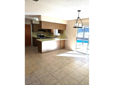 Move in ready pool home with 2 bedrooms, 1 & 1/2 baths & 1 car on Sherman Hills Golf Club in Florida - for sale on GolfHomes.com, golf home, golf lot