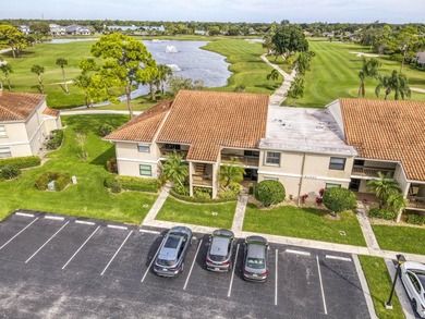 Delightful Eastpointe condo with gorgeous lake and golf views on Old Marsh Golf Club in Florida - for sale on GolfHomes.com, golf home, golf lot