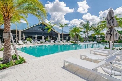 Delightful Eastpointe condo with gorgeous lake and golf views on Old Marsh Golf Club in Florida - for sale on GolfHomes.com, golf home, golf lot