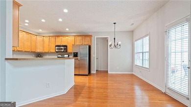 Discover this beautifully maintained 5-bedroom, 3.5 bath home on Summergrove Golf Club in Georgia - for sale on GolfHomes.com, golf home, golf lot