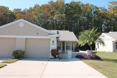 Nice 2 Bedroom 2 Bathroom End Unit Villa Located on in the Quiet on Meadow Oaks Golf and Country Club in Florida - for sale on GolfHomes.com, golf home, golf lot