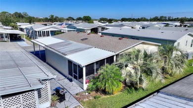 This beautifully maintained, Sun Manufactured home is ONE OF THE on Sweetwater Golf and Tennis Club in Florida - for sale on GolfHomes.com, golf home, golf lot