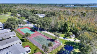 This beautifully maintained, Sun Manufactured home is ONE OF THE on Sweetwater Golf and Tennis Club in Florida - for sale on GolfHomes.com, golf home, golf lot