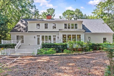 Enjoy sweeping lake views and an exceptional location just steps on Great Waters Course At Reynolds Plantation in Georgia - for sale on GolfHomes.com, golf home, golf lot