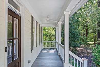 Enjoy sweeping lake views and an exceptional location just steps on Great Waters Course At Reynolds Plantation in Georgia - for sale on GolfHomes.com, golf home, golf lot