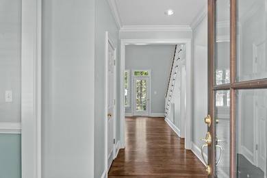 Enjoy sweeping lake views and an exceptional location just steps on Great Waters Course At Reynolds Plantation in Georgia - for sale on GolfHomes.com, golf home, golf lot