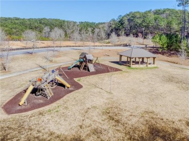 Welcome to this beautifully wooded lot nestled in the heart of on The Highlands Course at Lake Arrowhead in Georgia - for sale on GolfHomes.com, golf home, golf lot