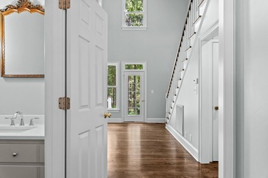 Enjoy sweeping lake views and an exceptional location just steps on Great Waters Course At Reynolds Plantation in Georgia - for sale on GolfHomes.com, golf home, golf lot