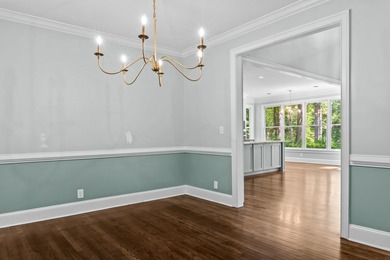 Enjoy sweeping lake views and an exceptional location just steps on Great Waters Course At Reynolds Plantation in Georgia - for sale on GolfHomes.com, golf home, golf lot