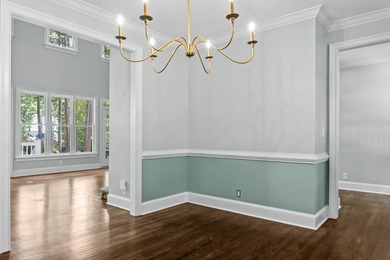 Enjoy sweeping lake views and an exceptional location just steps on Great Waters Course At Reynolds Plantation in Georgia - for sale on GolfHomes.com, golf home, golf lot