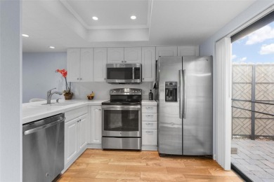 Welcome to this beautifully updated 2 bedroom, 2 and a half bath on East Lake Woodlands Country Club in Florida - for sale on GolfHomes.com, golf home, golf lot