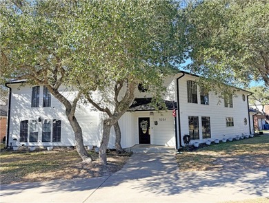 This classic-style 2-story residence is a statement of elegance on Rockport Country Club in Texas - for sale on GolfHomes.com, golf home, golf lot