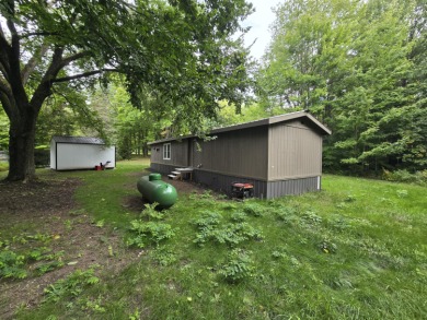 Own Your Up-North Escape! Why rent when you can own this on Lakes of the North Deer Run Golf Course in Michigan - for sale on GolfHomes.com, golf home, golf lot