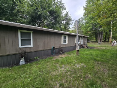 Own Your Up-North Escape! Why rent when you can own this on Lakes of the North Deer Run Golf Course in Michigan - for sale on GolfHomes.com, golf home, golf lot