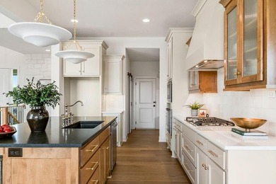 The Sequoia floor plan is a reverse 1.5-story home that offers on Heritage Park Golf Course in Kansas - for sale on GolfHomes.com, golf home, golf lot