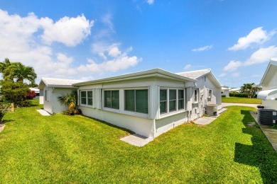Nestled within 55+ Palm Beach Leisureville, this expanded on Leisureville Community Golf Course in Florida - for sale on GolfHomes.com, golf home, golf lot