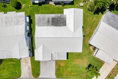 Nestled within 55+ Palm Beach Leisureville, this expanded on Leisureville Community Golf Course in Florida - for sale on GolfHomes.com, golf home, golf lot