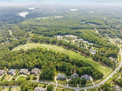 Introducing an Extraordinary Luxury Estate in the Heart of on Hasentree Club in North Carolina - for sale on GolfHomes.com, golf home, golf lot