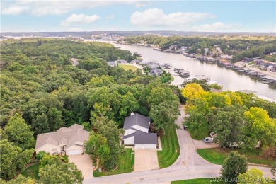 This well-maintained residence boasts a myriad of desirable on The Oaks Golf Course in Missouri - for sale on GolfHomes.com, golf home, golf lot