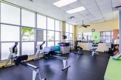 Nestled within 55+ Palm Beach Leisureville, this expanded on Leisureville Community Golf Course in Florida - for sale on GolfHomes.com, golf home, golf lot