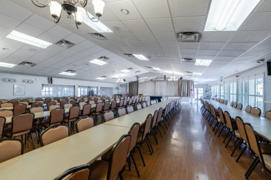 Nestled within 55+ Palm Beach Leisureville, this expanded on Leisureville Community Golf Course in Florida - for sale on GolfHomes.com, golf home, golf lot
