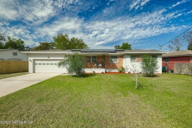 This well-maintained 1960s concrete block home blends classic on Blue Cypress Golf Club in Florida - for sale on GolfHomes.com, golf home, golf lot