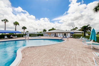 Nestled within 55+ Palm Beach Leisureville, this expanded on Leisureville Community Golf Course in Florida - for sale on GolfHomes.com, golf home, golf lot