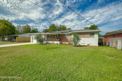 This well-maintained 1960s concrete block home blends classic on Blue Cypress Golf Club in Florida - for sale on GolfHomes.com, golf home, golf lot