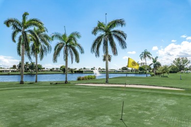 Nestled within 55+ Palm Beach Leisureville, this expanded on Leisureville Community Golf Course in Florida - for sale on GolfHomes.com, golf home, golf lot