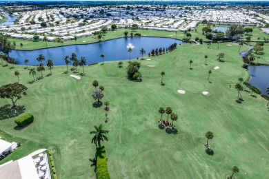 Nestled within 55+ Palm Beach Leisureville, this expanded on Leisureville Community Golf Course in Florida - for sale on GolfHomes.com, golf home, golf lot