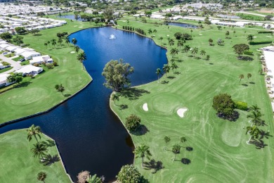 Nestled within 55+ Palm Beach Leisureville, this expanded on Leisureville Community Golf Course in Florida - for sale on GolfHomes.com, golf home, golf lot