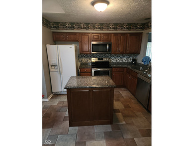 This single-family home is located in a corner of Indianapolis on William Sahm Golf Course in Indiana - for sale on GolfHomes.com, golf home, golf lot