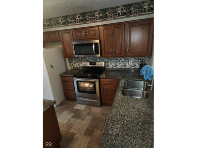 This single-family home is located in a corner of Indianapolis on William Sahm Golf Course in Indiana - for sale on GolfHomes.com, golf home, golf lot