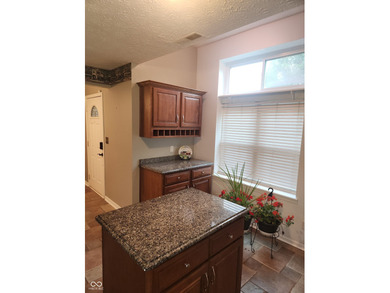 This single-family home is located in a corner of Indianapolis on William Sahm Golf Course in Indiana - for sale on GolfHomes.com, golf home, golf lot