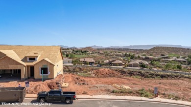 Experience breathtaking views of the city, mountains, and golf on Coral Canyon Golf Course in Utah - for sale on GolfHomes.com, golf home, golf lot