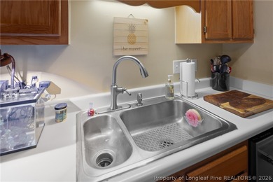 Welcome to this charming 3-bedroom, 2-bath home located in Hope on Hope Mills Golf and Country Club in North Carolina - for sale on GolfHomes.com, golf home, golf lot