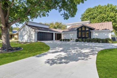 Recently renovated in 2024, this elegant, 4-bedroom, 3 on Slick Rock Golf Course - Horseshoe Bay in Texas - for sale on GolfHomes.com, golf home, golf lot