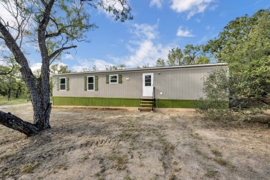 NEW DOUBLEWIDE 3 bed 2 bath home thoughtfully placed on this on Packsaddle Country Club in Texas - for sale on GolfHomes.com, golf home, golf lot