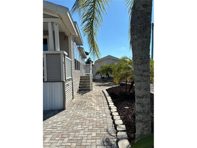 NO LOT RENT!! YOU OWN THE LAND!! Beautifully updated home in the on Southern Dunes Golf and Country Club in Florida - for sale on GolfHomes.com, golf home, golf lot